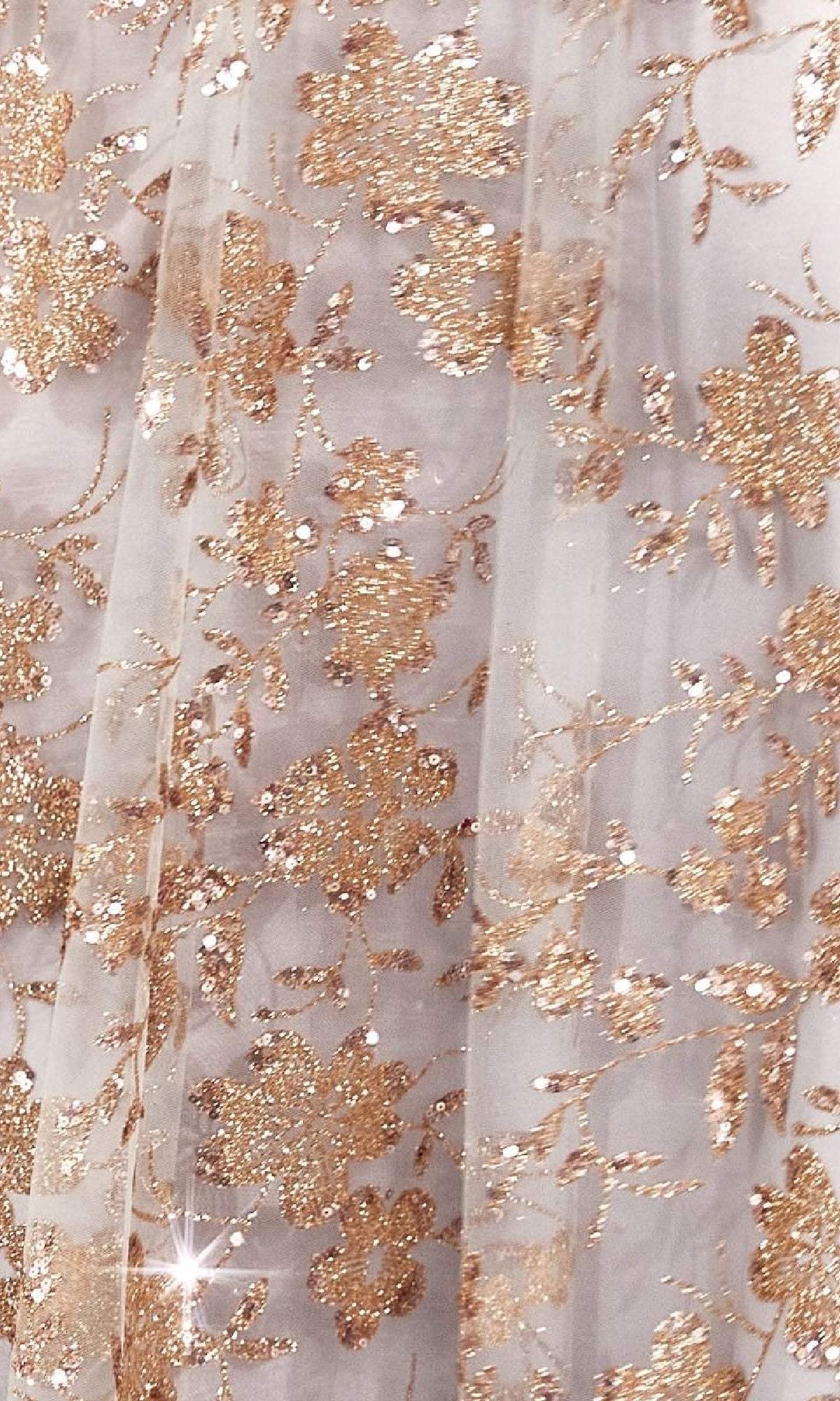 Close-up of sheer white fabric with gold glitter floral embroidery and sequin details on the Amoris T606 Embroidered-Lace Long Prom Dress, perfect for a budget-friendly formal or elegant evening gown.